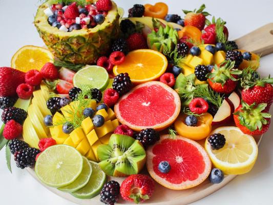 Cutting board with cut fruit